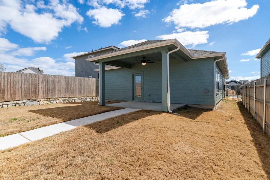 Back of property featuring a ceiling fan, a patio, and a fenced backyard