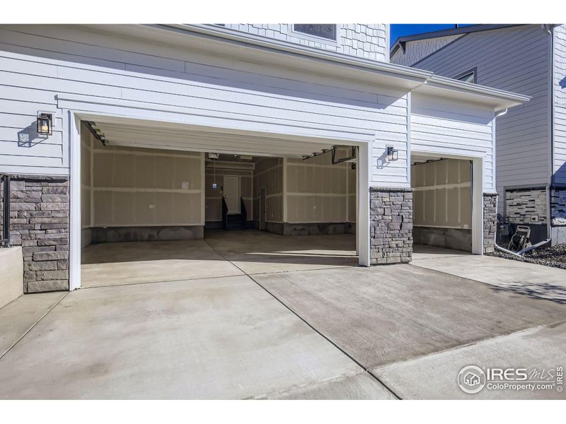Exterior details and patio area of a home in RainDance - 60s, Windsor (Image 17).