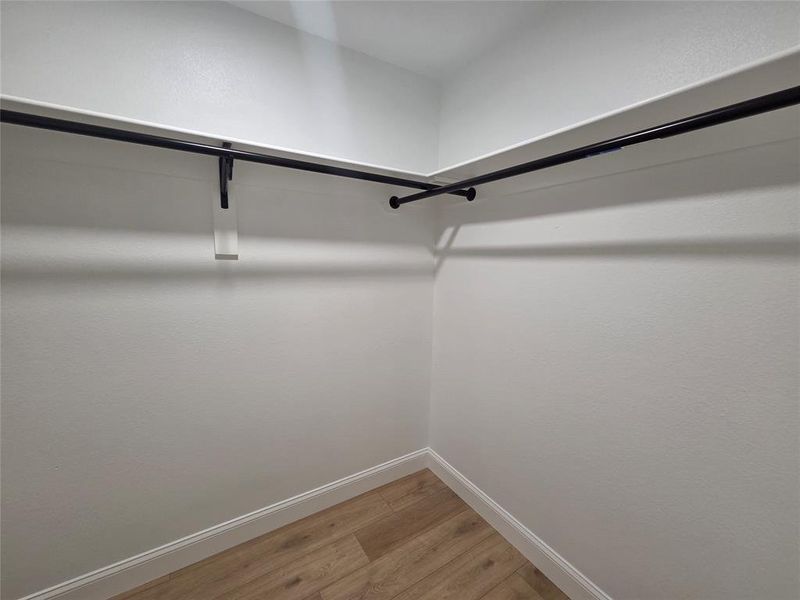 Primary Walk-In Closet. Primary Walk-In Closet.