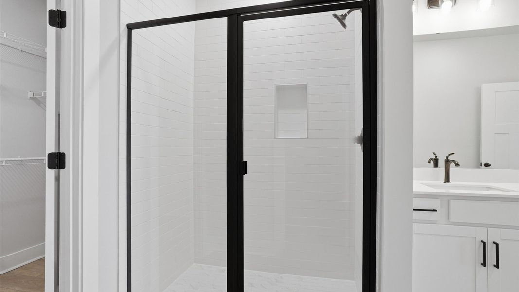 Sophisticated primary bathroom with a spacious walk-in shower and polished hardware located at Silo Ridge Sophisticated primary bathroom with a spacious walk-in shower and polished hardware located at Silo Ridge
