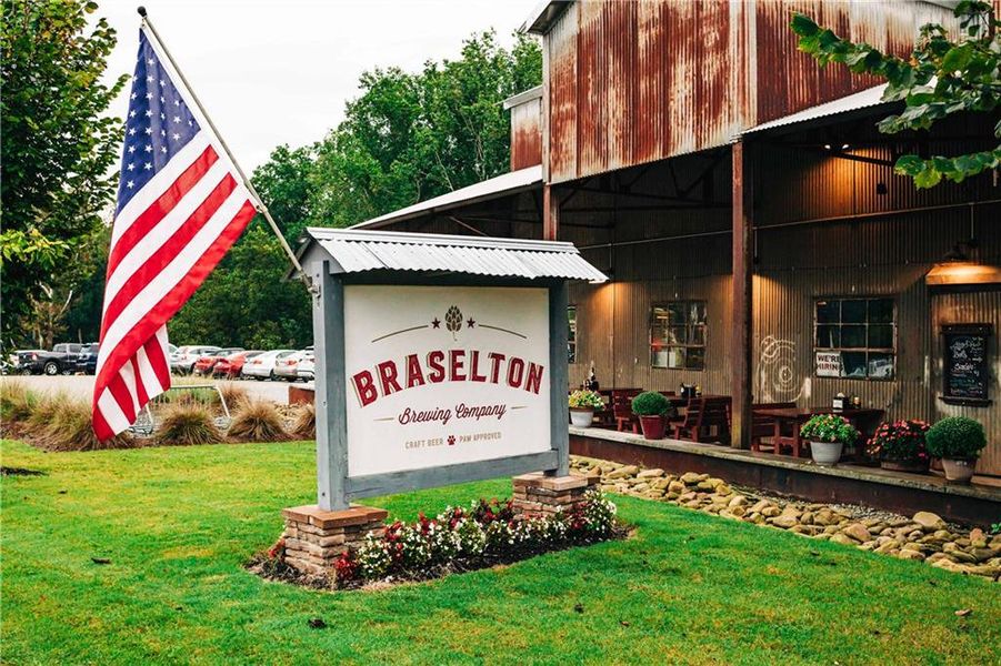 Front exterior of a new home in Rosewood Lake Estates, Hoschton, GA, highlighting curb appeal (Image 39).