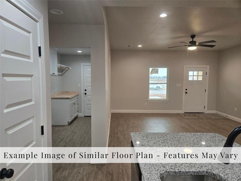 Foyer entrance with light wood-style flooring, recessed lighting, and a ceiling fan