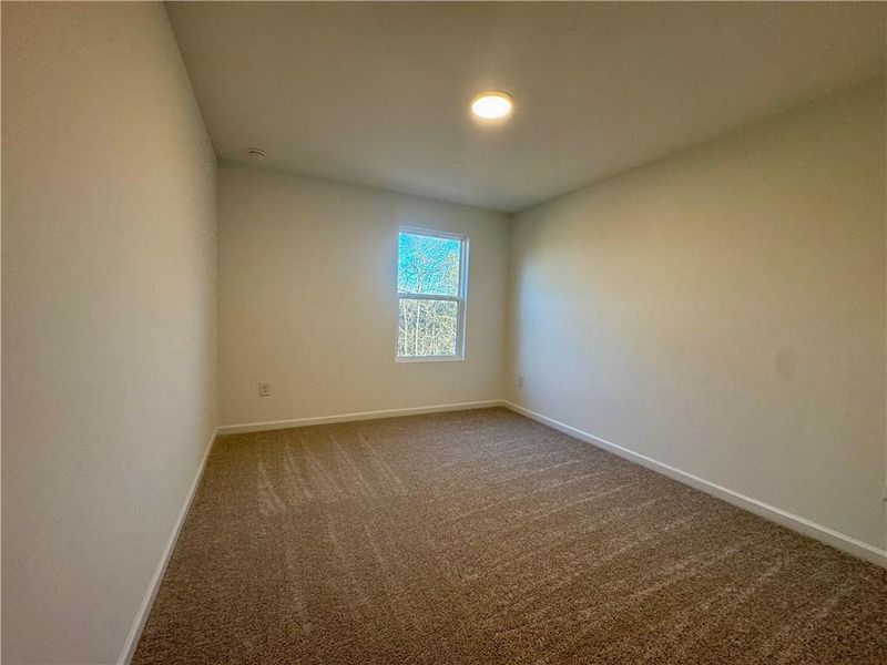 Spacious, unfurnished interior of a new home in Eastlyn Crossing, Flowery Branch (Image 25).