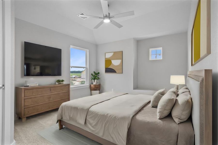 Secondary bedroom features plush carpet, custom paint, ceiling fan, large window with privacy blinds, and private access to a secondary bathroom vanity, shared shower/tub combo, and toilet.