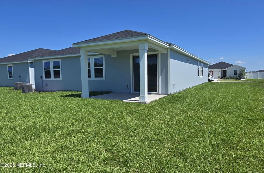 Front exterior of a new home in Lakes at Bella Lago - Signature Series, Green Cove Springs, FL, highlighting curb appeal (Image 2).