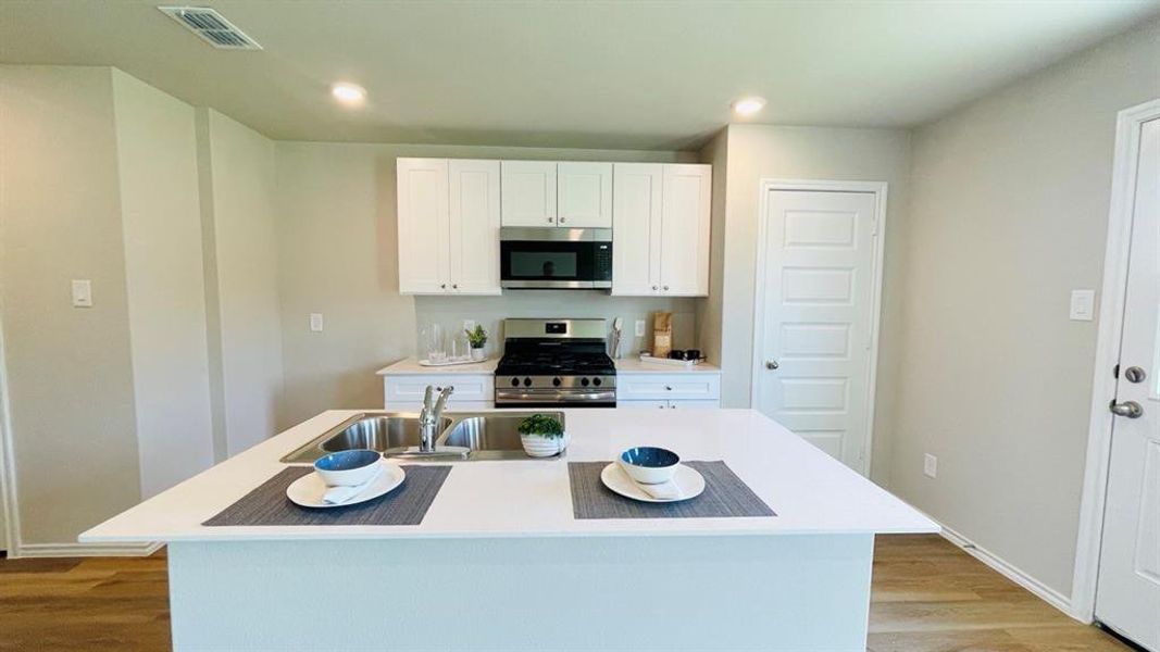 Kitchen - All Home and community information, including pricing, included features, terms, availability and amenities, are subject to change at any time without notice or obligation. All Drawings, pictures, photographs, video, square footages, floor plans, elevations, features, colors and sizes are approximate for illustration purposes only and will vary from the homes as built. Kitchen - All Home and community information, including pricing, included features, terms, availability and amenities, are subject to change at any time without notice or obligation. All Drawings, pictures, photographs, video, square footages, floor plans, elevations, features, colors and sizes are approximate for illustration purposes only and will vary from the homes as built.