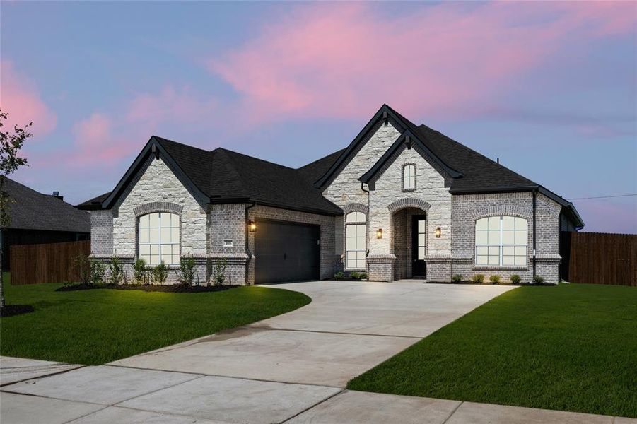Front exterior of a new home in Coyote Crossing, Godley, TX, highlighting curb appeal (Image 23). Front exterior of a new home in Coyote Crossing, Godley, TX, highlighting curb appeal (Image 23).