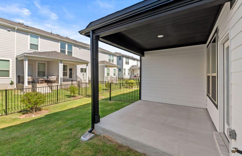 Front exterior of a new home in Whitestone Preserve, Cedar Park, TX, highlighting curb appeal (Image 26).
