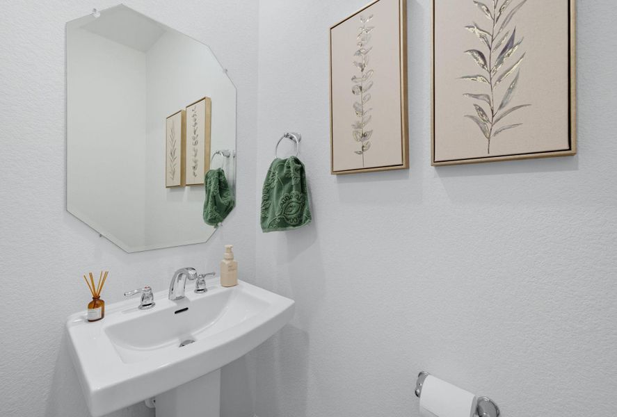 Bathroom featuring a textured wall Bathroom featuring a textured wall