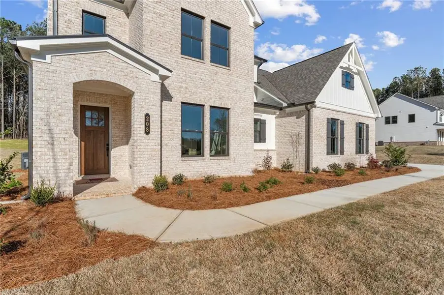 Exterior details and patio area of a home in The Reserve at Knollwood, Canton (Image 25).