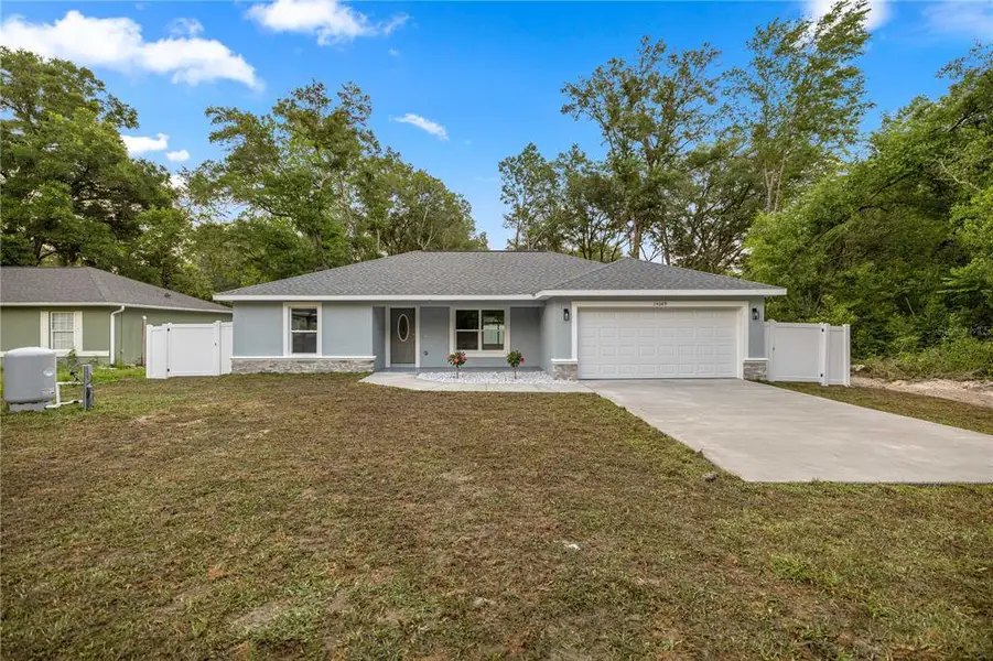 Front exterior of a new home in , Summerfield, FL, highlighting curb appeal (Image 1). Front exterior of a new home in , Summerfield, FL, highlighting curb appeal (Image 1).