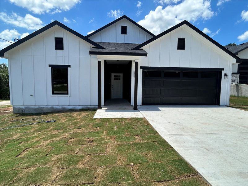 Front exterior of a new home in , Bastrop, TX, highlighting curb appeal (Image 1). Front exterior of a new home in , Bastrop, TX, highlighting curb appeal (Image 1).