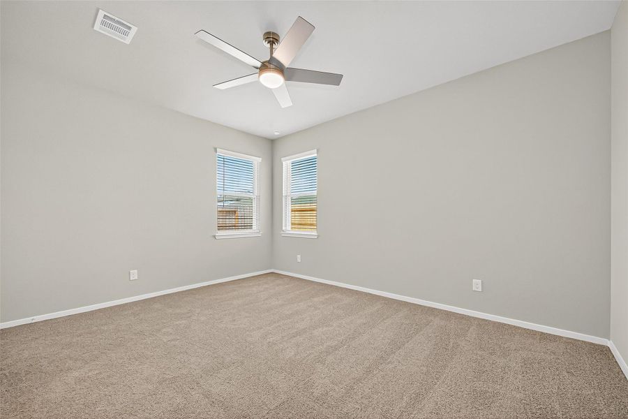Spacious, unfurnished interior of a new home in Sunterra, Katy (Image 40).
