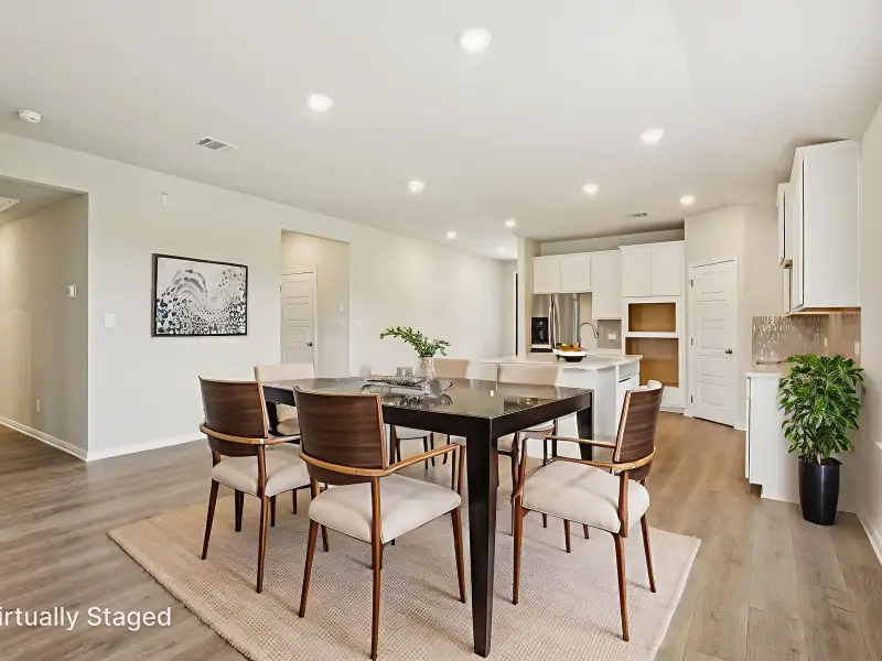 Dining room in the Oleander floorplan at a Meritage Homes community.