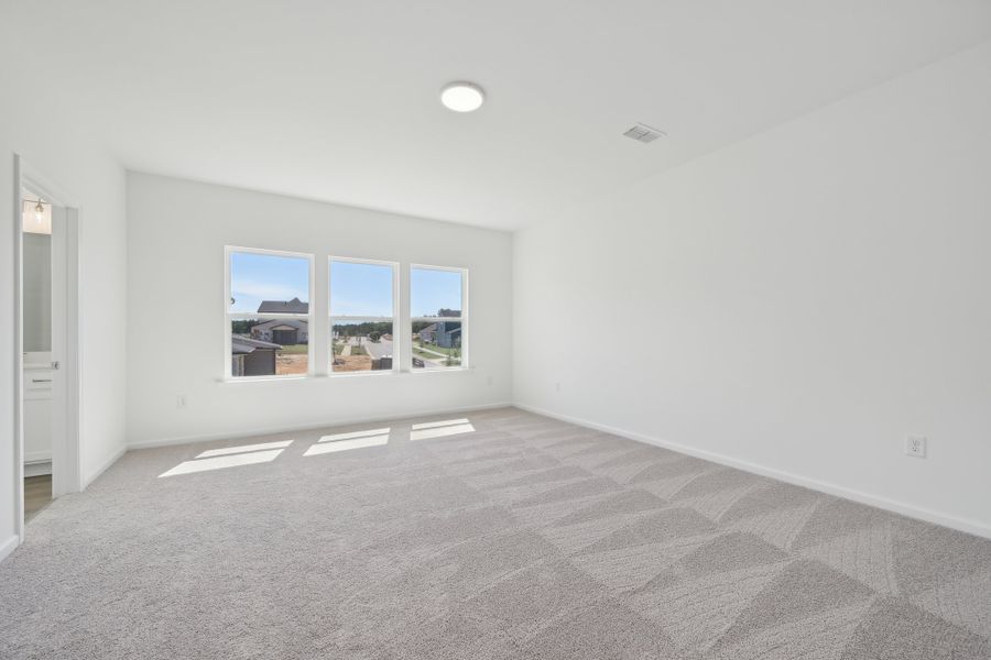 Representative unfurnished interior of a home built from the Jordan by Ashton Woods in Rowland's Grant, Fuquay Varina (Image 34).
