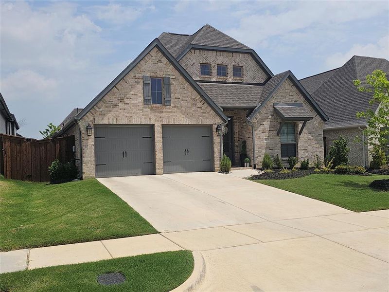 Front exterior of a new home in M3 Ranch, Mansfield, TX, highlighting curb appeal (Image 2). Front exterior of a new home in M3 Ranch, Mansfield, TX, highlighting curb appeal (Image 2).