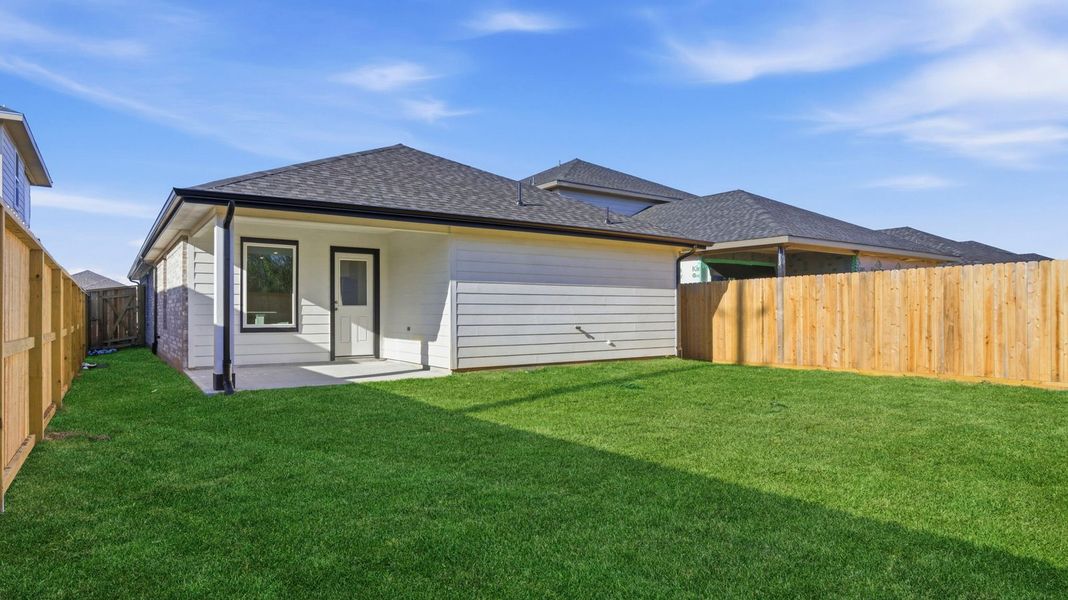 Exterior details and patio area of a home in Lakes at Westland Ranch, League City (Image 18).