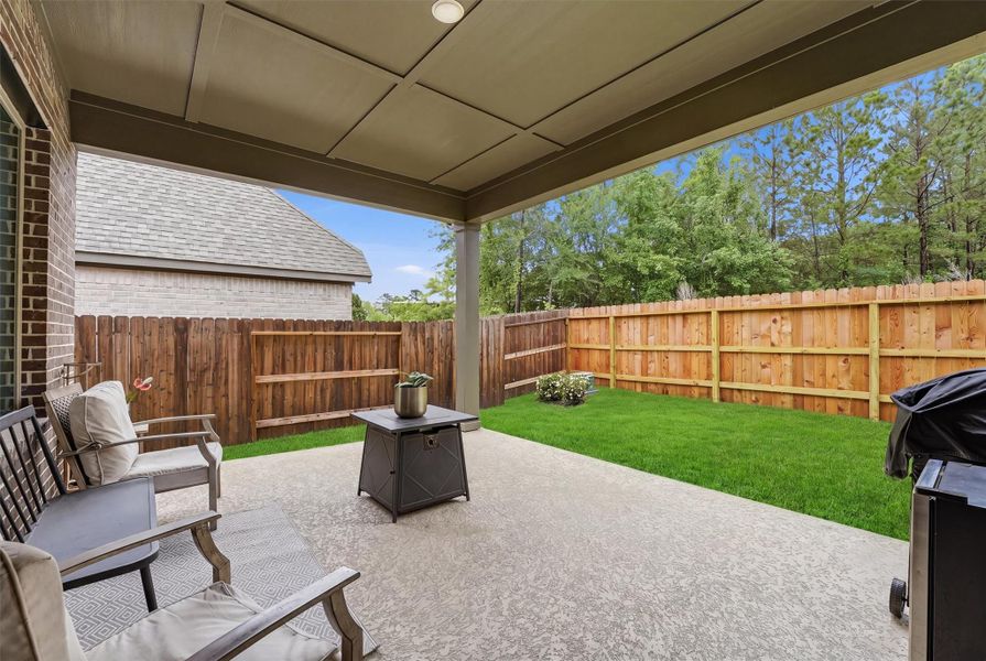 Extended back patio with stamped and painted concrete