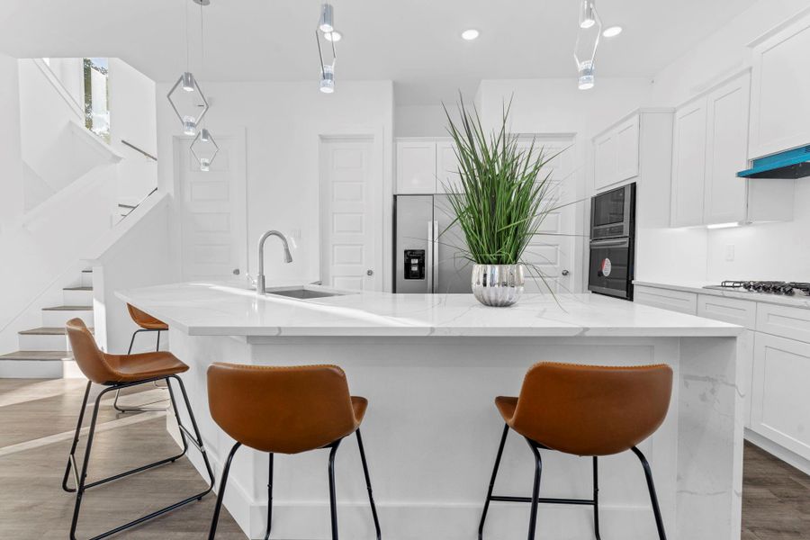 Spacious island with waterfall edges, perfect for cooking and gathering. Spacious island with waterfall edges, perfect for cooking and gathering.