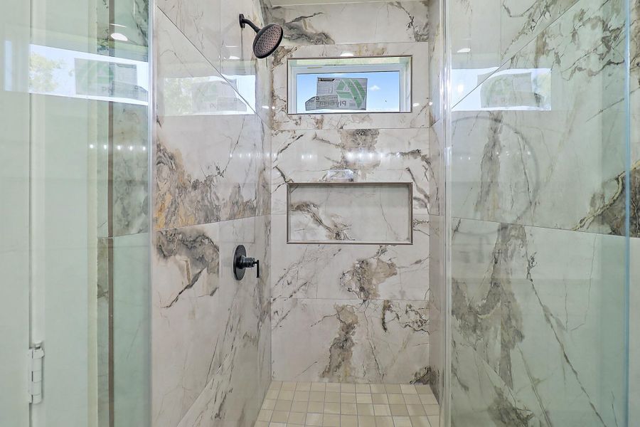 Custom tile work in this oversized shower - you'll feel like you're in a spa!