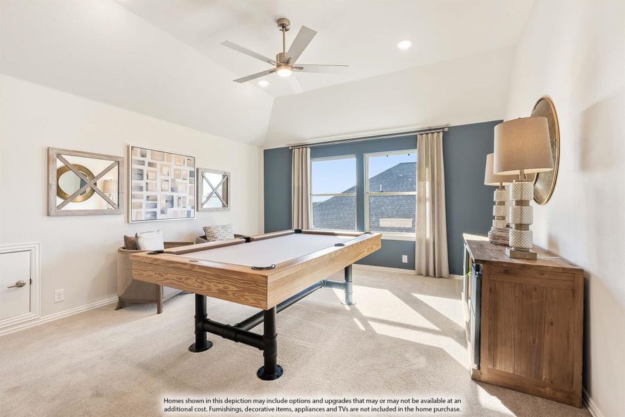 Game room with pool table, vaulted ceiling, ceiling fan, and blue accent wall