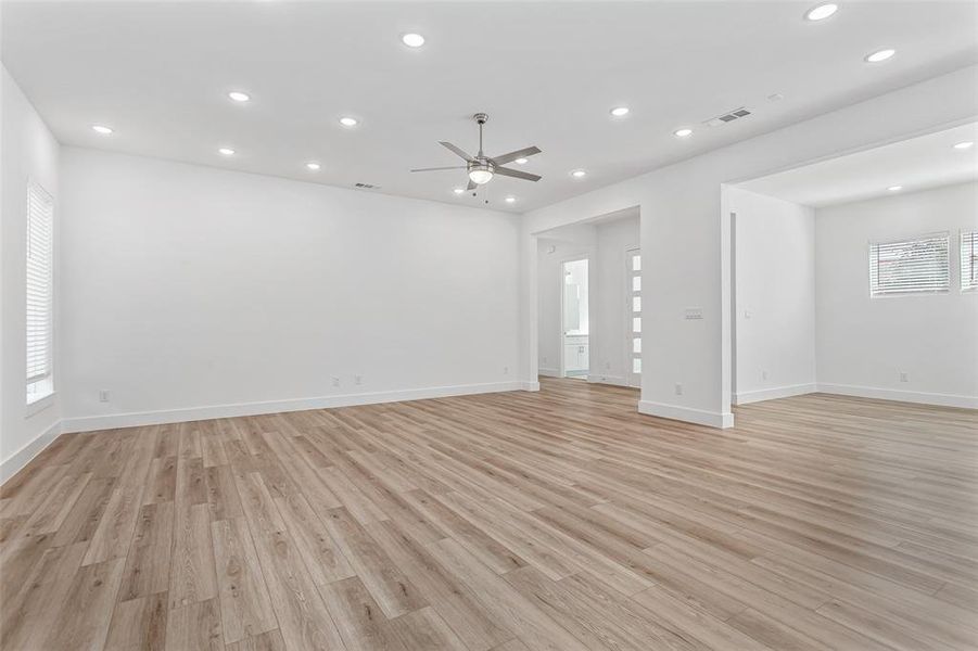 Unfurnished living room with recessed lighting, light wood-style floors, and ceiling fan