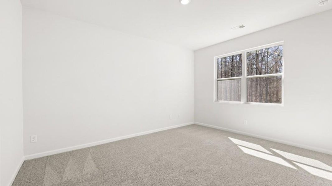 Spacious, unfurnished interior of a new home in South Wind, Fairburn (Image 22).