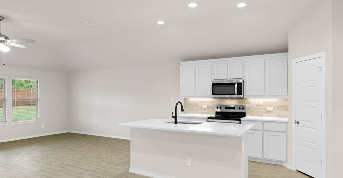 Representative exterior photo of a completed home built from the Austin by Impression Homes in Keeneland, Aubrey, TX (Image 8).