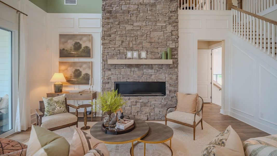 Gathering room with fireplace and access to rear porch Gathering room with fireplace and access to rear porch