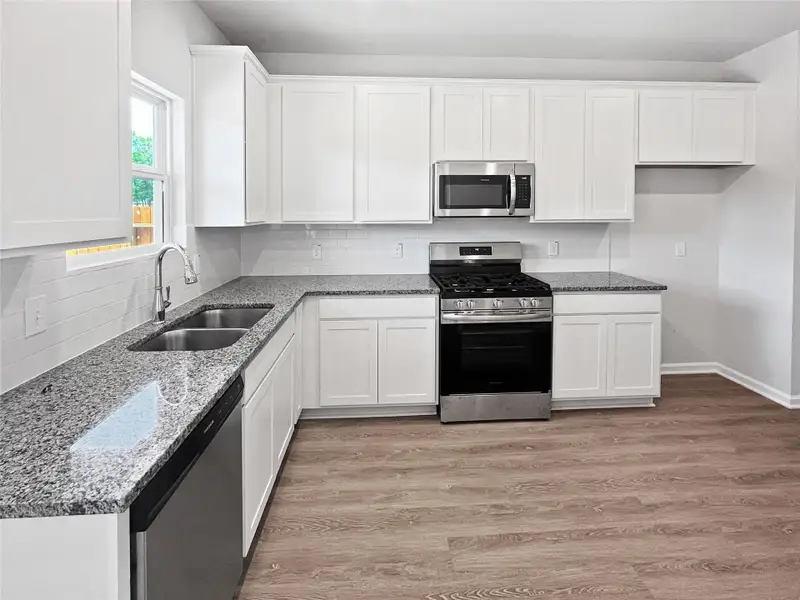 The Blue Jay II- Kitchen. Home under construction, photo used for illustrative purposes only, colors and options will vary.