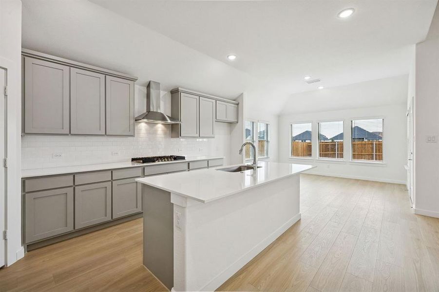 Kitchen in the Gilmour II home plan by Trophy Signature Homes – REPRESENTATIVE PHOTO