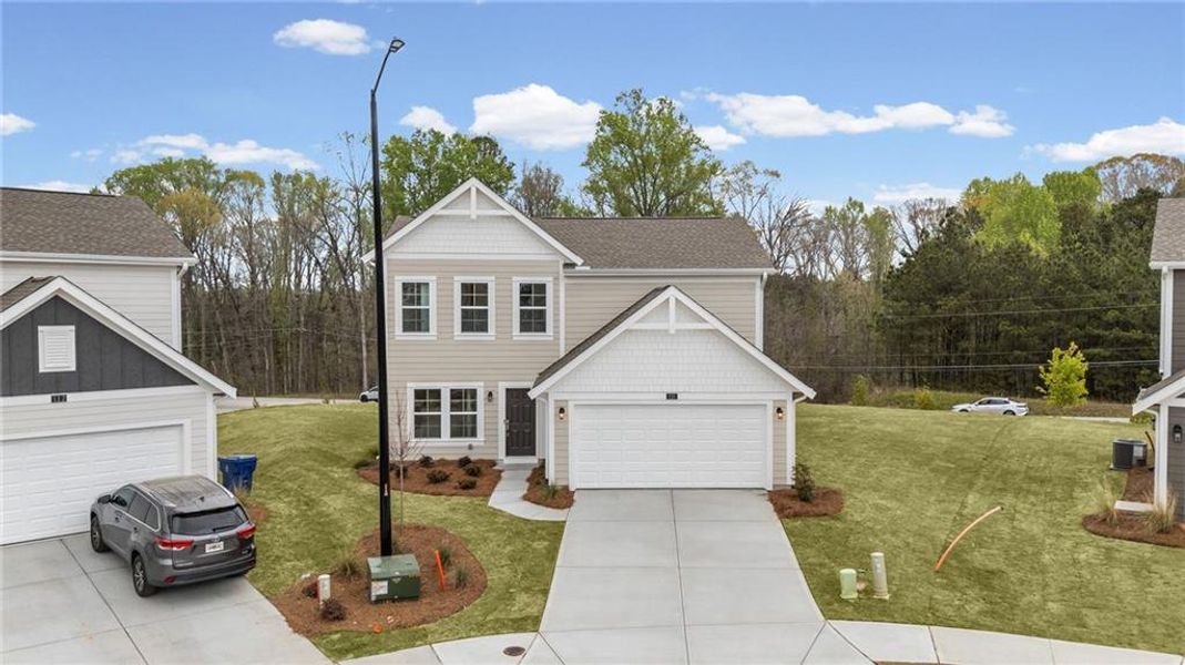 Front exterior of a new home in Sage Woods, Dallas, GA, highlighting curb appeal (Image 20).