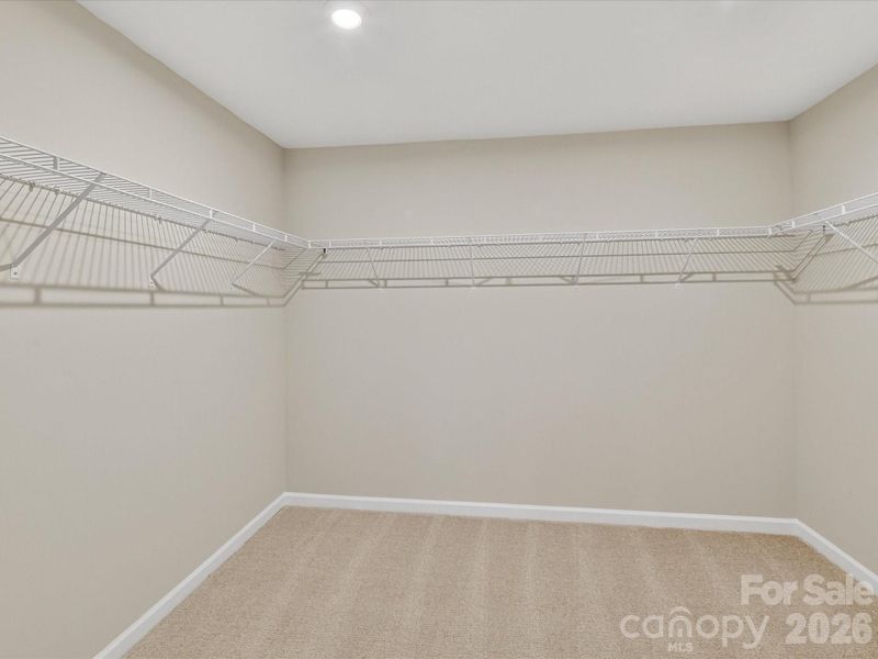 Primary Walk-In Closet. Primary Walk-In Closet.