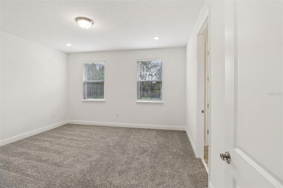 Spacious, unfurnished interior of a new home in Legends Preserve - Signature Series, Daytona Beach (Image 28).