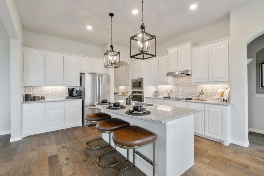 Kitchen | Concept 2434 at Coyote Crossing in Godley, TX by Landsea Homes