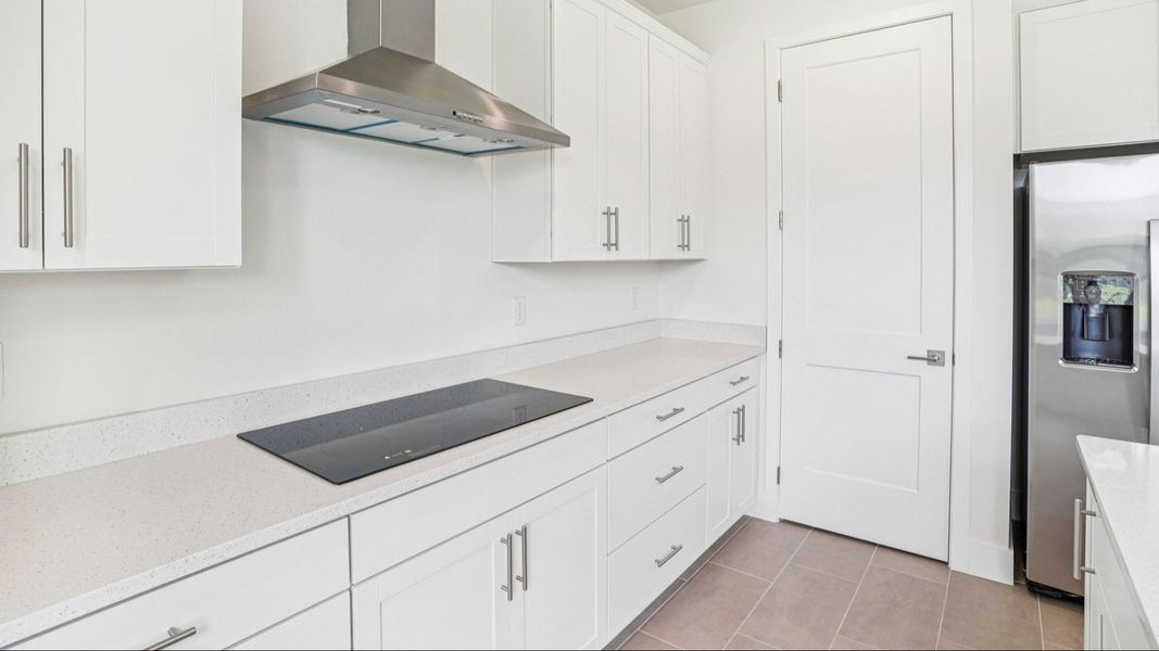 Plumeria Floor Plan featuring a bright kitchen glass stove top by DRB Homes in Trailside located in Mount Dora, FL Plumeria Floor Plan featuring a bright kitchen glass stove top by DRB Homes in Trailside located in Mount Dora, FL