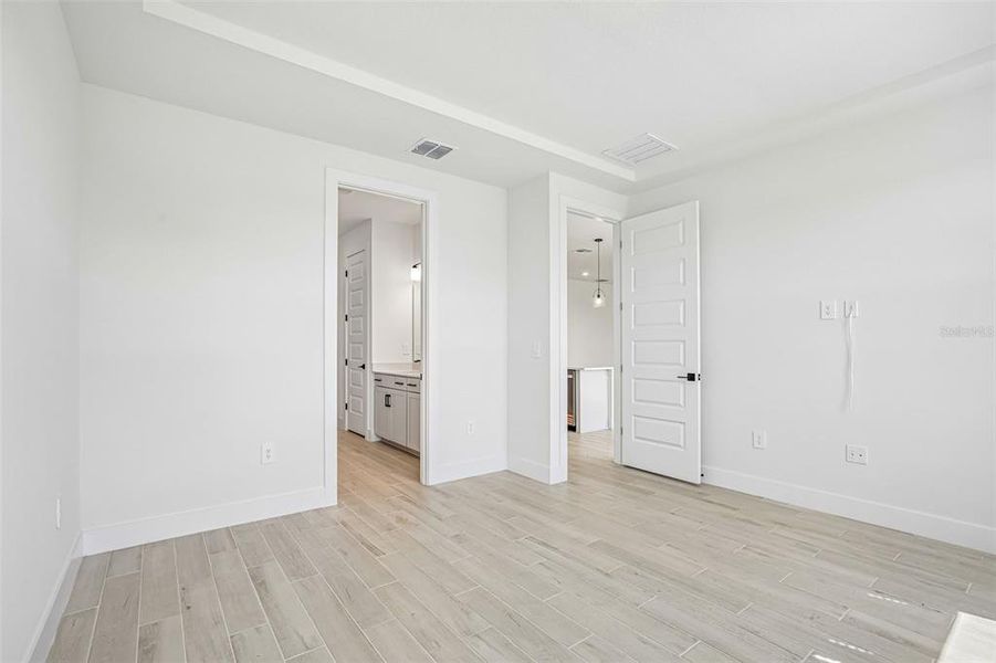 Spacious, unfurnished interior of a new home in Magnolia Bay - Reserve Series, Nokomis (Image 23).