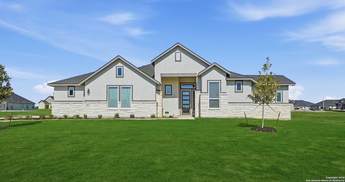 Front exterior of a new home in Sienna Lakes, San Antonio, TX, highlighting curb appeal (Image 26). Front exterior of a new home in Sienna Lakes, San Antonio, TX, highlighting curb appeal (Image 26).