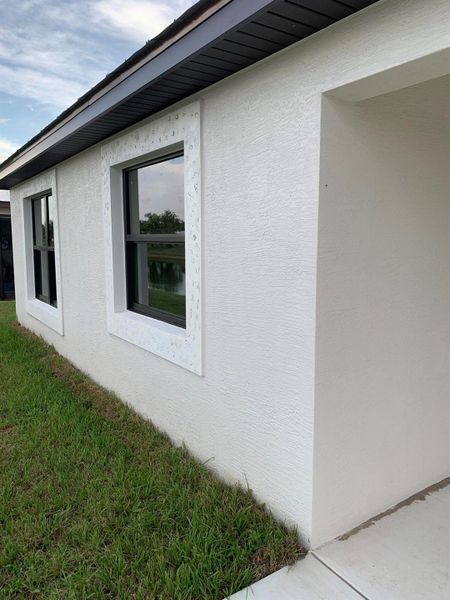 Front exterior of a new home in , Port St. Lucie, FL, highlighting curb appeal (Image 14).