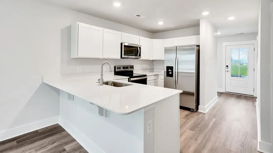Furnished interior view inside a new home in The Townes at Cedar Hill Landing, Navassa (Image 6).