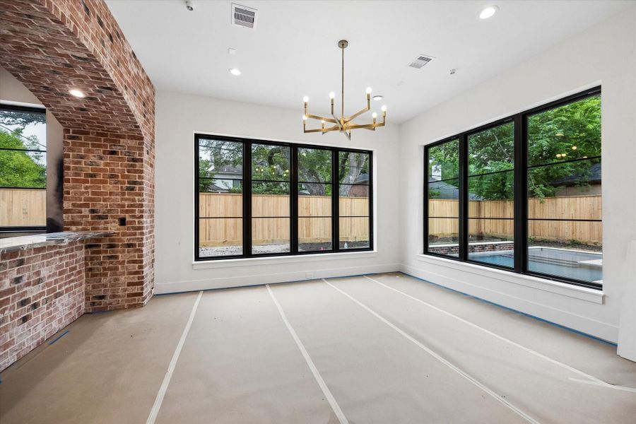 Charming dining room overlooking backyard. Pictured April 2026.