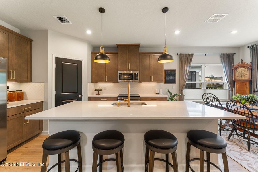 Furnished interior view inside a new home in Seminole Palms Single-Family Homes, Palm Coast (Image 54).