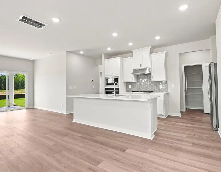 Furnished interior view inside a new home in Country Lane - Classic Series, Clayton (Image 6).