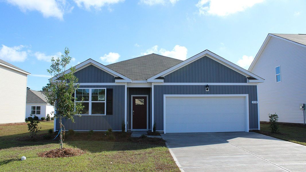 Representative exterior photo of a completed home built from the Cali by D.R. Horton in Pinewood Estates, Conway, SC (Image 15).