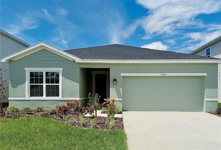 Front exterior of a new home in Summerwoods, Parrish, FL, highlighting curb appeal (Image 1).