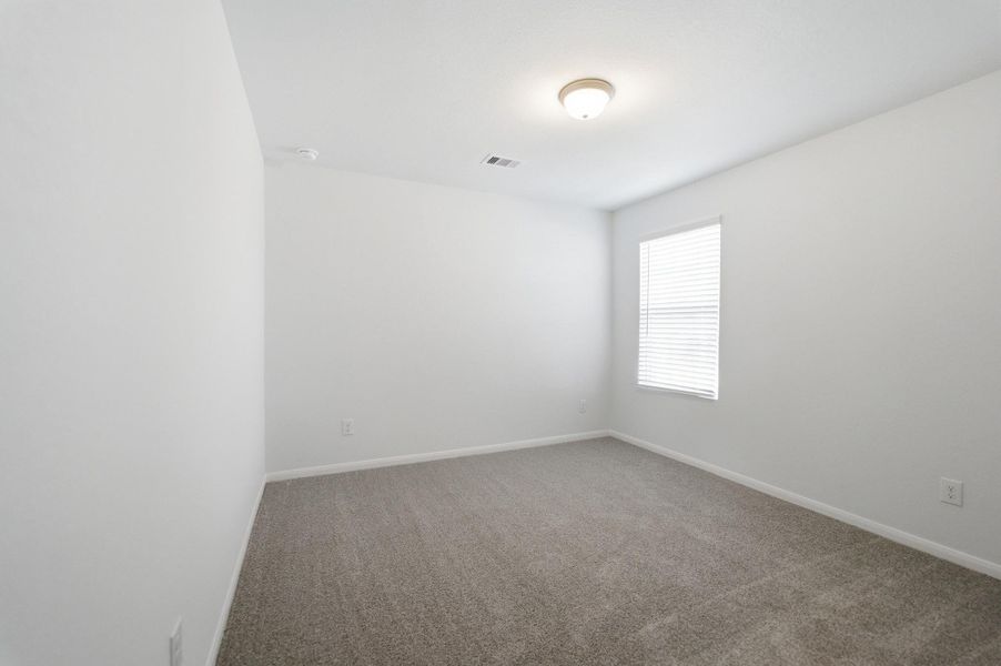Spacious, unfurnished interior of a new home in The Pines at Seven Coves, Willis (Image 25).
