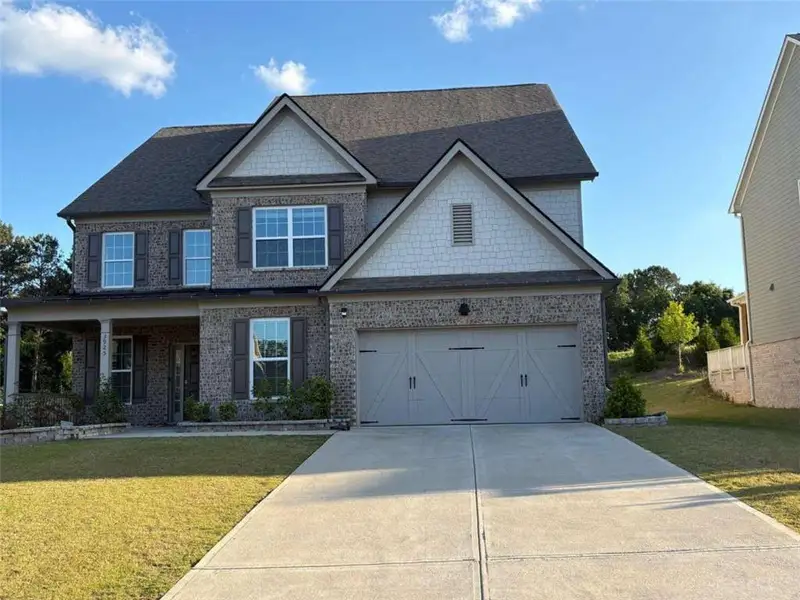 Front exterior of a new home in Briarwood, Cumming, GA, highlighting curb appeal (Image 1). Front exterior of a new home in Briarwood, Cumming, GA, highlighting curb appeal (Image 1).