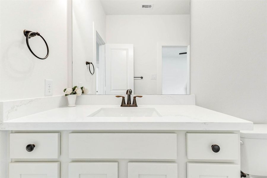 Brushed bronze hardware and soft closing cabinetry. Brushed bronze hardware and soft closing cabinetry.