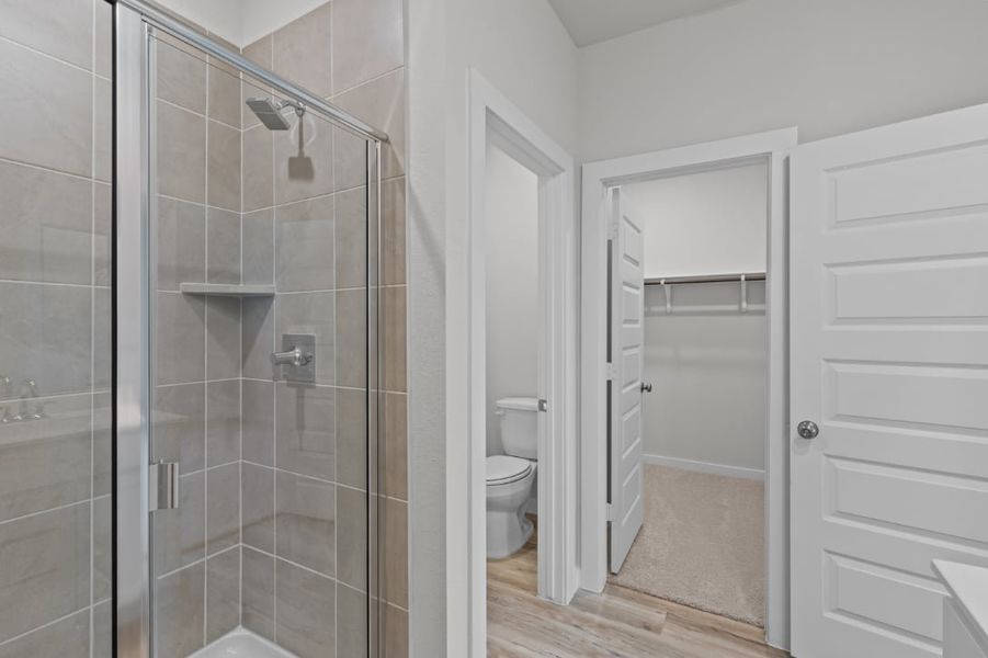 A bathroom with a glass shower.