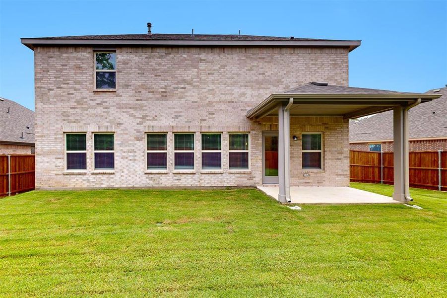 Front exterior of a new home in Kings Way, Denton, TX, highlighting curb appeal (Image 17). Front exterior of a new home in Kings Way, Denton, TX, highlighting curb appeal (Image 17).